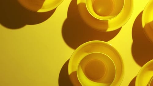 Vibrant Yellow Bowls on Yellow Background
