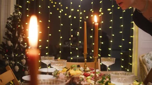 Festive Holiday Dinner Celebration with Candles and Lights
