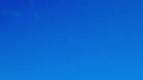 Clouds Floating in Bright Blue Sky