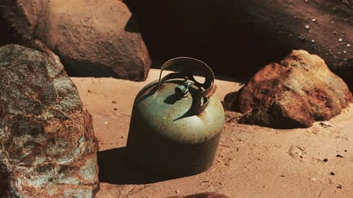 Old Cooking Gas Cylinder on Sand Beach
