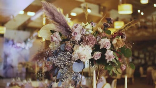 Elegant Wedding Floral Arrangement with Roses and Candles