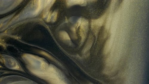 Colorful Golden Sand Organically Moves in Colorful Liquid