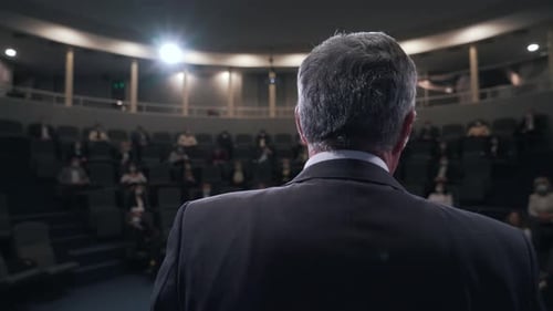 a Speaker Performs at a Conference