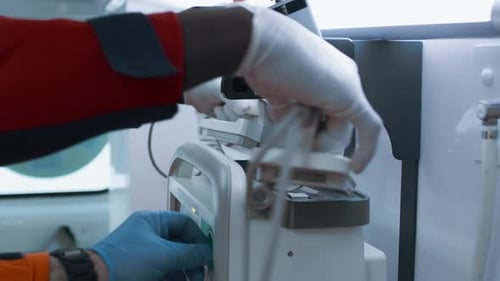 Crop Doctors Using Defibrillator on Patient