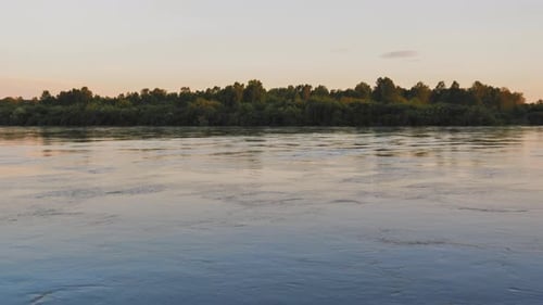 Waves on Water Surface of River at Beautiful Soft Sunset