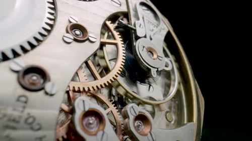 Intricate Vintage Watch Gears Moving in Close Up