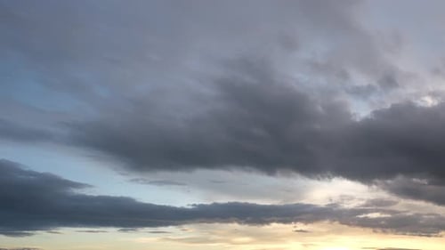 Dramatic Clouds Passing During Colorful Sunset Time-Lapse