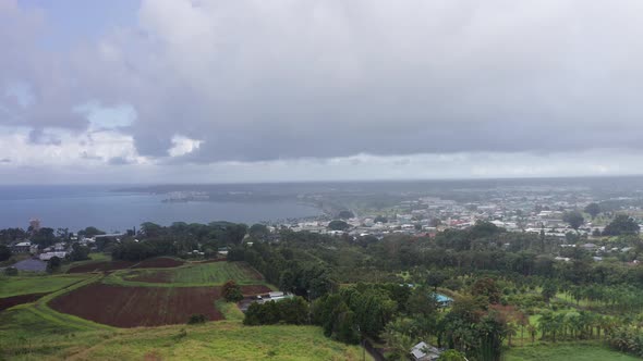 Aerial wide shot of downtown Hilo in the rain on the Big Island of ...