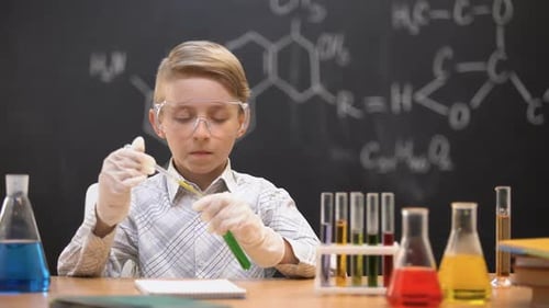 Child Scientist Conducting Chemistry Experiment at School