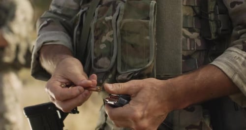 Crop Soldier Reloading Weapon During Battle