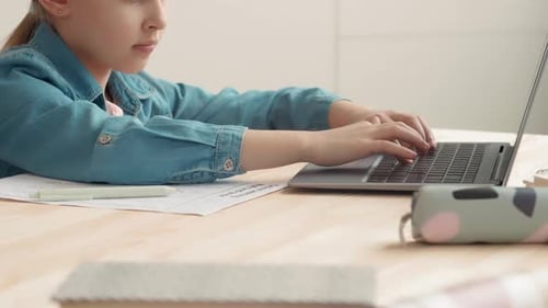 Child Using Laptop for Education at Home