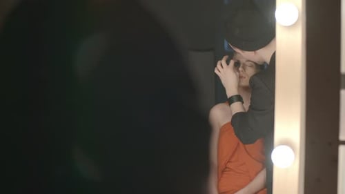 Makeup Artist Applying Makeup to a Young Woman