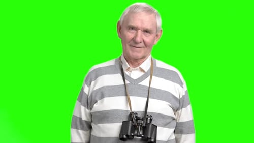 Smiling Senior Man with Binoculars, Green Screen