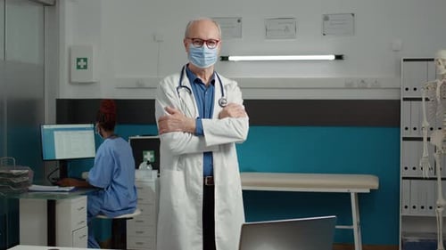 Portrait of Male Doctor with Face Mask Working in Health Care System