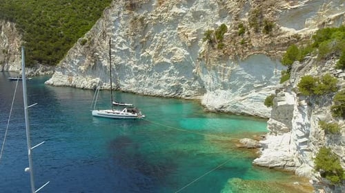 Aerial view group of boats anchored on mountain shore, Greece.