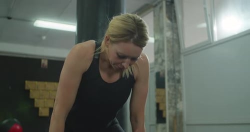 Fitness Woman Tired After Strength Training Exercise at Gym