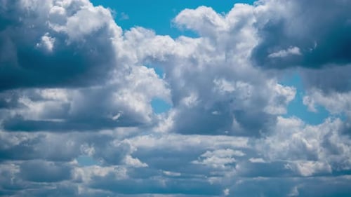 White Clouds Drifting Across a Blue Sky