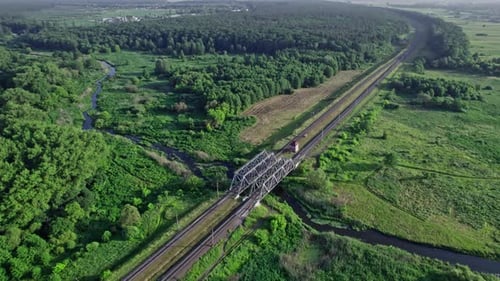 Railway Bridge in Countryside Passing Above Small River