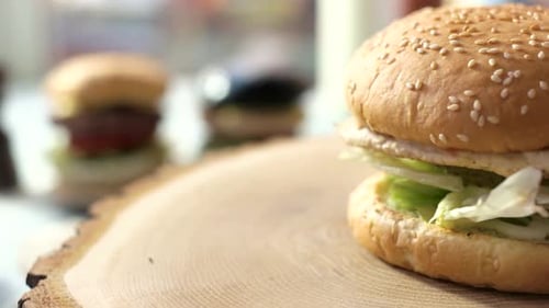 Juicy Burger on Wooden Slab Close Up
