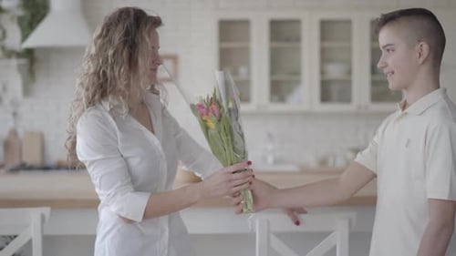 Son Gifts Mother Bouquet of Flowers at Home