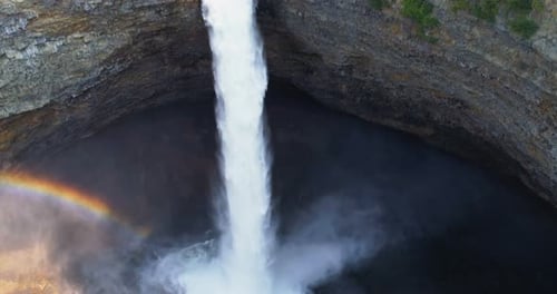 Breathtaking Waterfall Plunging into Rocky Basin