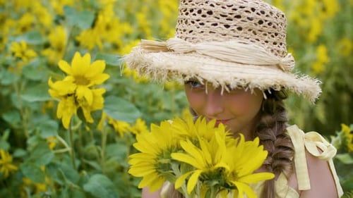 Portrait Beautiful Girl in Straw Hat with Yellow Sunflowers on Village Field. Happy Young Girl