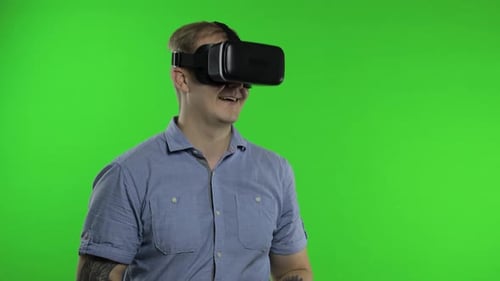 Man Using VR Headset Helmet To Play Game. Watching Virtual Reality 3d 360 Video. Chroma Key