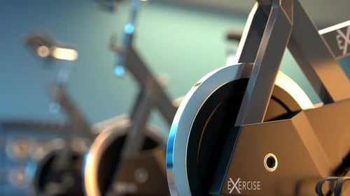 Fitness Bicycles or spinning bikes in the modern gym. Cardio, health, wellness.