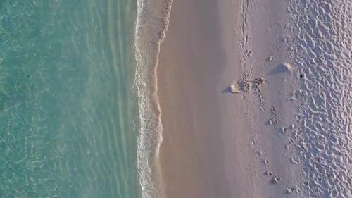 Drone aerial texture of marine resort beach trip by ocean with sand background