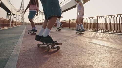 Group of Skaters Boys and Girls Ride Their Skateboards