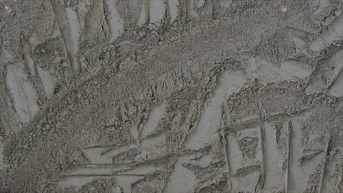 Makeup Brush Moving Through Gray Powder