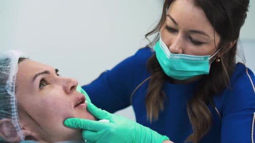 Brunette Cosmetologist Does Antiaging Filler Injection