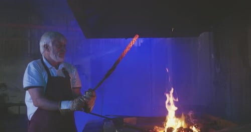 Blacksmith Working With Very Hot Fire and Metal