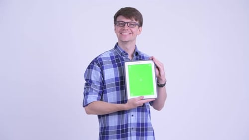 Young Adult Presenting Tablet with Green Screen