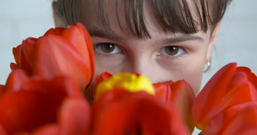 Girl with Flowers Smiling Close Up