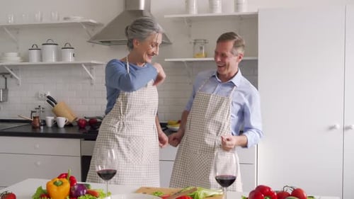 Senior Couple Dancing Together in Kitchen