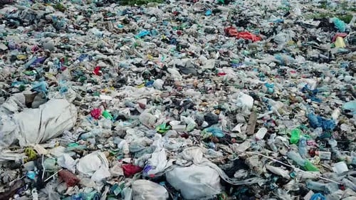 Plastic in the mountains, Mountain garbage, large garbage pile, degraded garbage.