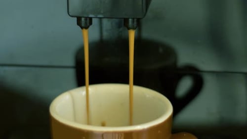Espresso Streams Flowing into Coffee Mug