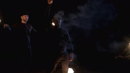 Skilled Fire Artists Performing Outdoor at Night