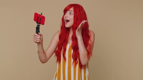 Woman with Red Hair Talking on Phone
