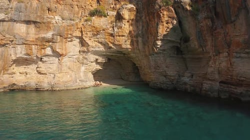 Tourist People Relax in a Hidden Cove with a Cave in Mountain on the Road From Demre To Antalya
