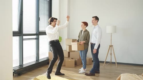 Young Caucasian Couple Moving Into New Apartment Realtor Or Real Estate Agent Make Successful Work
