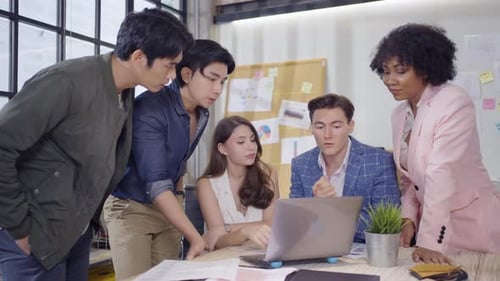 Diverse Team Collaborating in Modern Office Environment