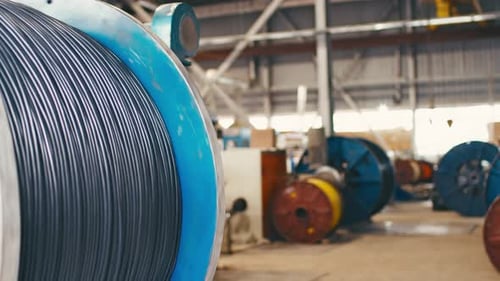 Spinning Reel with Cable in Cable Production Plant Closeup