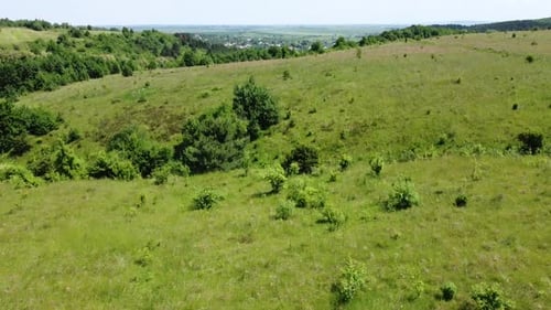 Aerial drone view of a flying over the rural agricultural landscape.