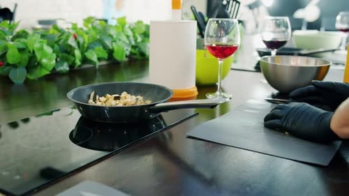 Close-up of Cook's Hands Putting Vegetables in Frying Pan and Preparing Meal