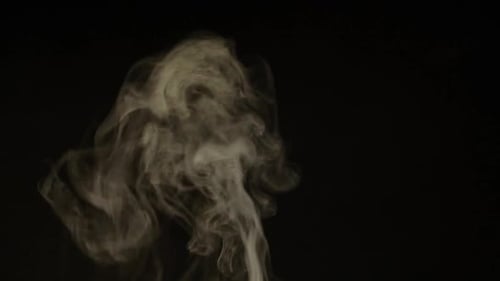 White Smoke Drifting on a Black Background