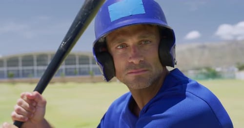 Baseball players holding baseball bat