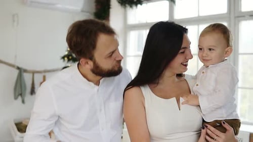 Loving Family Smiles Together at Christmas