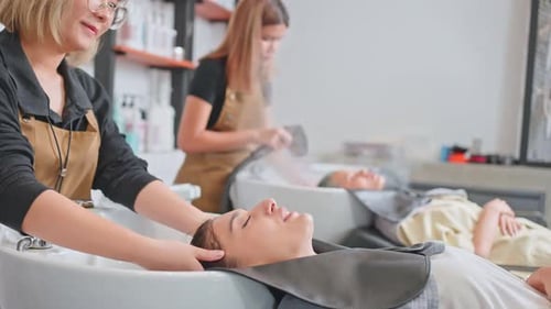 Woman Receiving Relaxing Hair Wash at Salon
